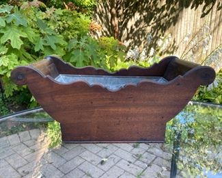 19th c. mahogany zinc lined vessel with brass wheels        7 3/4"H x 18"L x 8 1/2"D