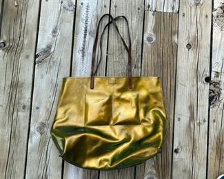 b. may      gold tone bag                                                          