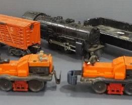 Train Car Assortment, Includes Lionel Dump Car, Unmarked Engine, Box Car, Lionel Logger, And More