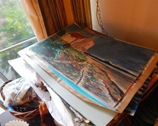 A stack of original water colors.