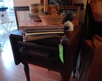 Antique drop leaf side table .