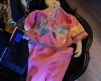 Asian doll with pottery face.