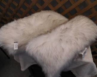 2 very fluffy Threshold toss pillows-long 12inx24in, one has rip on seam (see pictures)