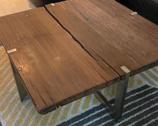 Solid wood coffee table with metal legs. Corners need sanding/touching up.  $300 as is.