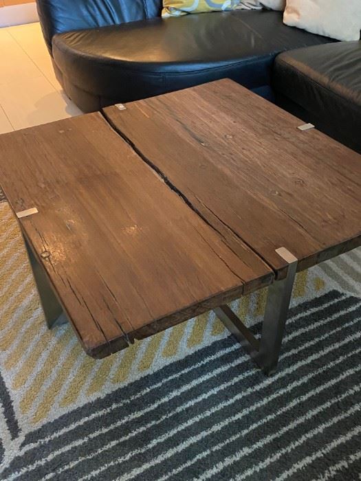 Solid wood coffee table with metal legs. Corners need sanding/touching up.  $300 as is.