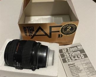 Nikkor 28-70 mm f/3.5-4.5D lens.  Box and manual included, missing lens cap. $50.