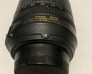 Nikkor 18-105 mm f3.5-5.6G ED VR lens. Has lens cap. One loose metal ring.  $75.