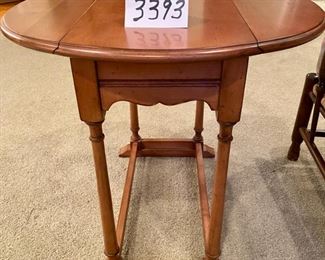 Lot 3393. $125.00. Again, I cannot believe that no one picked up this dropleaf table for half price of $62.50..  It's such a warm honey maple color, very attractive,  When the sides are down, it fits in a nice snug space to hold a lamp, etc., but if you are entertaining and need to bring it out to put appetizers, or what have you, it jumps to the rescue.  Maple Dropleaf Side Table 26" Round, makes a great looking side table.  26" L x 13" W x 24" H	Excellent Condition!