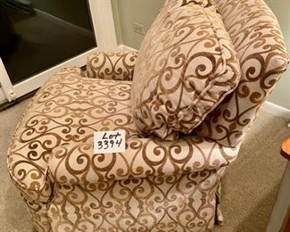 Lot 3394. $325.00  Jessica Charles Upholstered Swivel Rocker Chair in Olive and Cream Fabric. Excellent Condition and very comfortable.  31" W x 33" D x  20.5 to Arm Rest.	Note:  I must have taken 30 photos of this chair, and couldn't get the color to cooperate if my life depended on it, lol.  Flash, no flash, sunny, not sunny! The color in the design is not this brownish color but rather is a lighter hue of the green behind this chair.  Why it was coming out this color is beyond me.  Anyway, if you are interested when you come to pick up your stuff, ask to see this in person.  Another great piece that seems to be overlooked.  