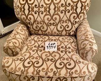 Lot 3394. $325.00  Jessica Charles Upholstered Swivel Rocker Chair in Olive and Cream Fabric. Excellent Condition and very comfortable.  31" W x 33" D x  20.5 to Arm Rest.	Note:  I must have taken 30 photos of this chair, and couldn't get the color to cooperate if my life depended on it, lol.  Flash, no flash, sunny, not sunny! The color in the design is not this brownish color but rather is a lighter hue of the green behind this chair.  Why it was coming out this color is beyond me.  Anyway, if you are interested when you come to pick up your stuff, ask to see this in person.  Another great piece that seems to be overlooked.  