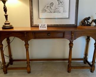 Lot 3400  $275.00  Vintage Drexel Console Table in Dark Oak Finish, 1 middle drawer and 6 Legs. 60" L x 14" D x 25" H	 This is another sweet designer piece - easily can hug a wall as shown, can sit behind a sofa to hold a lamp and some decor, many folks use a sofa table like this so they don't put a sofa right over heat registers.  This is a great combination of form and function, and Drexel (Heritage) makes a very fine table.  Buy it now at half price!!