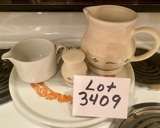Lot 3409. $24.00 Dansk White Creamer - such a functional piece!, Longaberger Pottery Pitcher, and Longaberger Sugar or Salt Shaker, and last, a Pizza Cooking Plate by Shefford.  Has the recipe for pizza dough on the plate, some wording starting to fade.  Fun lot!