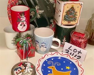 Lot 3412. $30.00  12 pieces random Christmas items - Christmas Night porcelain bank, 4.5" x 3.5", Gift Bag music bag plays Deck the Halls, Reindeer plate for Santa's cookies, 8" diam. by TAG, 3 Holiday pins in a sterling rim coaster, 5 Holiday Mugs, in various sizes, Miscellaneous paper plates, beaded garland...