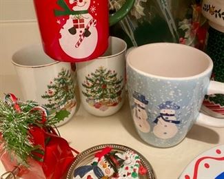 Lot 3412. $30.00  12 pieces random Christmas items - Christmas Night porcelain bank, 4.5" x 3.5", Gift Bag music bag plays Deck the Halls, Reindeer plate for Santa's cookies, 8" diam. by TAG, 3 Holiday pins in a sterling rim coaster, 5 Holiday Mugs, in various sizes, Miscellaneous paper plates, beaded garland...