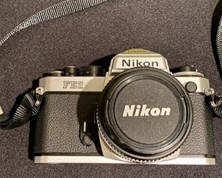 Lot 3405  $125.00. Nikon FE-2 SLR Film Camera in Excellent Condition, Includes Nikkor 50mm 1.1.8 Lens and Nikon CF-2 Case.