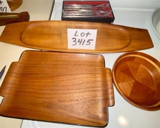 Lot 3415 $45.00  Serving Lot of: 1. Teak Wood Tray Perfect for Sushi, Made in Japan, 13.5" L x 8.25" W  2. Teak Serving Tray Made in Haiti 23" x 6"  3.  2" High Round Monkey Wood Nut Bowl 7" Diam. x 2" H  4. Set of Steak 6 Knives, Scandinavian Style.	13.5" L x 8.25" W
