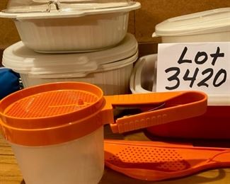Lot 3420  $50.00. Assorted and Tupperware Lot: Tupperware flour sifter, Rubbermaid pan strainer, Tupperware 10"x6" marinating container w/orange bar, Tupperware large meat marinating dish (12"x10.5"x3.25"), 2, 6 1/2" sq x 2" tall with generic containers w/lids, Rubbermaid 1 qt. microwave cooking dish w/lid, 3 pc. Rubbermaid bacon cooker and 2 qt. microwave steamer.