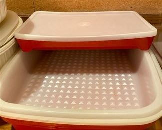 Lot 3420  $50.00. Assorted and Tupperware Lot: Tupperware flour sifter, Rubbermaid pan strainer, Tupperware 10"x6" marinating container w/orange bar, Tupperware large meat marinating dish (12"x10.5"x3.25"), 2, 6 1/2" sq x 2" tall with generic containers w/lids, Rubbermaid 1 qt. microwave cooking dish w/lid, 3 pc. Rubbermaid bacon cooker and 2 qt. microwave steamer.