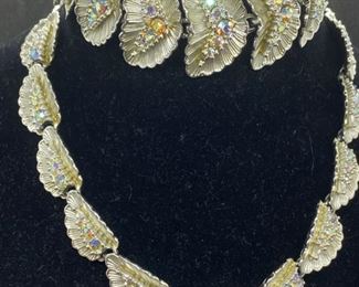 Jewelry Lot 4000-A  $40.00. 3 pc Parure Jewelry set plus extra - 1.  15.5 vintage necklace with 11 Silver leaf-shapes w/3 graduated crystals or rhinestone inserts in each leaf.  Catches the light beautifully. 2.  Matching Bracelet with 9 leaves, 8" length, safety chain lock.  3.  Matching earrings, 1 - 1/4" stars (one tiny stone missing), 4.  18" Stainless Modern cute necklace.  