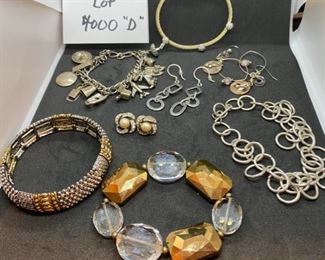 Jewelry Lot 4000-D. $45.00. 8 pieces of nice Costume Jewelry:  1. Vintage Charm Bracelet w/12 Silver Plate Charms.  2.  Stretchy silver and gold-tone bracelet, 3.  Gold and Clear Lucite Type Bead Bracelet, 4.  Chain bracelet and 5. Matching earrings, 6. Pierced Hoop earrings, 7. Pearl & Rhinestone Earrings, 8.  One gold and silver bracelet.  Orig. Lot 1334