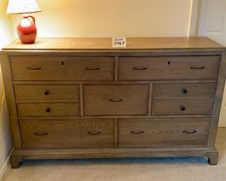 Lot 3467.  $295.00. 7-drawer dresser bachelor height by Riverside. Has some watermarks.  66" x 18" x 40"t
