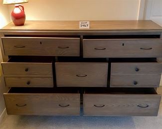 Lot 3467.  $295.00. 7 drawer dresser bachelor height by Riverside. Has some watermarks.  66" x 18" x 40"t