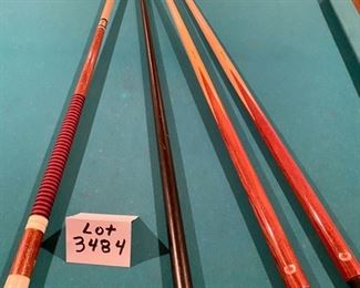 Lot 3484. $750.00.. 8' Regulation Pool Table, Includes Pool Cues, Racks, Brush, Cue Storage Rack & Set of Billiard Balls.  1950's style pool hall table w/nostalgic look. Will need to be professionally moved. Bumper cushions.   96" L x 57" W
