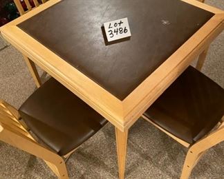Lot 3486. $95.00.  . Vintage 1950s Wood Card Table w/4 chairs. Vinyl slightly padded top on table and chairs.  One teeny blemish on the tabletop can be seen in the photo. 30"x30"x29"h