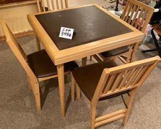 Lot 3486. $95.00.  . Vintage 1950s Wood Card Table w/4 chairs. Vinyl slightly padded top on table and chairs.  One teeny blemish on tabletop can be seen in the photo, otherwise in beautiful condition.  Nicest card table we've seen in a long time!  30"x30"x29"h