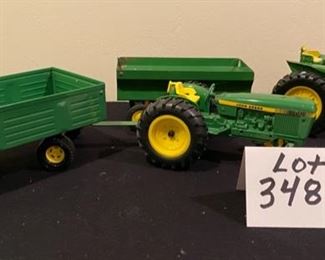 Lot 3487. $95.00. 6 Pc. Vintage John Deere Tractors & Wagons H6862, Plow and Disco Cultivator.  Wheels & Tires good shape. Paint on the newer tractor is excellent