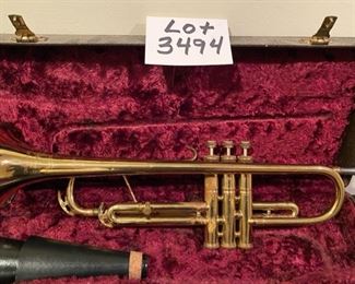 Lot 3494   $95.00. Pan American Trumpet, Vintage Made in Elkhart, IN, plus case, music stand, and mute. Serial No. 162971. This trumpet could probably use an inspection by a trumpet guy or gal - the keys move up & down smoothly but there is some surface wear starting .  Good project to rehabilitate this beauty during the time of Covid.  