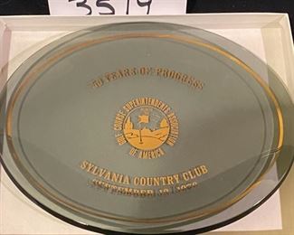 Lot 3519   $95.00 Golf Lot includes: Sylvania Country Club "50 Years of Progress Plaque, Box Signed by Arnold Palmer, "The Evolution  of Golf Balls" in Shadow Box (The Golf Ball Replicas include: Feathered, Hand Hammered, Machine Guttie, The Dunlop, Par Player, Nimble, Mesh Pattern, Golden Arrow and Air Flight;  Brass Golf Club Bookends and Hole-in-One Gumball Machine  