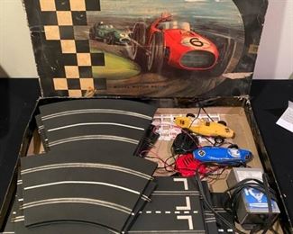 Lot 3522 $100.00 Vintage Scalextric Grand Prix Series Model Motor Racing Model #G.P.2 by Lionel-Tri-Ang includes Track, Transformer, 2 Slot Cars (1 is missing  2 Tires and the slot Car Connection on bottom of car. Box is in rough shape.