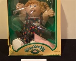 Lot 3537 $35.00. Cabbage Patch Kids Doll In Original Box, Still Secured to box, Doll is in amazing condiiton, box is as shown.  Adoption and Birth Cert and all info included! Adi Lois