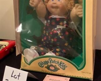Lot 3537 $35.00. Cabbage Patch Kids Doll In Original Box, Still Secured to box, Doll is in amazing condition, the box is as shown.  Adoption and Birth Cert and all info included! Adi Lois