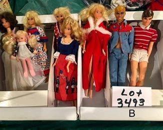 Lot 3493-B:   $40.00. Dolls: 2 Skippers, 3 Barbies, 2 Kens, 1 baby and a Barbie  Fashion Doll Trunk (1975)