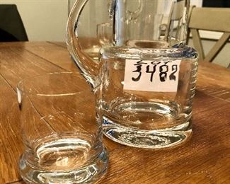 Lot 3482.  $70.00. Tiffany & Co. Glass Pitcher, Glass mug (not for sale, chip found on lip), Pitcher and drinking glass (also called a Night Set) from Romania,  and three cordials.  