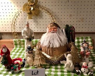 Lot 3539. $40. Big Lot of Christmas items:  2 Father Christmas Figures, Birch Hearts Friendship Snowman, Santa w/tree and votive holder, 2 Nancye Williams snowman figures, Snow Baby Bisque, Snowman for hire (Obviously), Gold Metal Star Basket and Rolly Santa! Gold Wreath with Santa.