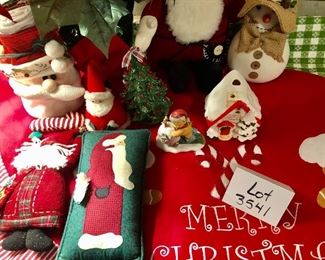 Lot 3541.  $60.00 Merry Christmas Tree Skirt (46"dia), Faux Pointsettia (20"h), Santa bag with Christmas Tea Towels, 2 plush felted santas (real cute), 1 quilted santa (Overly-Raker), 1 straw hat snowman with cute buttons, 1 santa pillow, ceramic tree (good shape, one missing berry and small chip), Cute snow house, 1 Wonderful World of Rambling Ted Figurine (OOOOPs) 1999. 