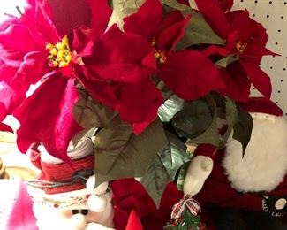 Lot 3541.  $60.00 Merry Christmas Tree Skirt (46"dia), Faux Pointsettia (20"h), Santa bag with Christmas Tea Towels, 2 plush felted Santas (real cute), 1 quilted Santa (Overly-Raker), 1 straw hat snowman with cute buttons, 1 Santa pillow, ceramic tree (good shape, one missing berry and small chip), Cute snow house, 1 Wonderful World of Rambling Ted Figurine (OOOOPs) 1999. 