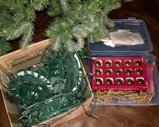Lot 3552. $95.00.  7.5 Foot Balsam Christmas Tree, a box of lights (not tested), and a box of gold-tone ornaments (balls, stars, and snowflakes). The tree doesn't have its original box but we have another box that it fits in for storage! Goes together in minutes (3 tiers and a stand)