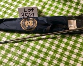 Lot 3569. $30.00. The putter is not branded Notre Dame but has some interesting marks to assist with Putting Angle and Position.  The sheath is blue nylon with the Notre Dame Logo in Gold. Gift Idea?