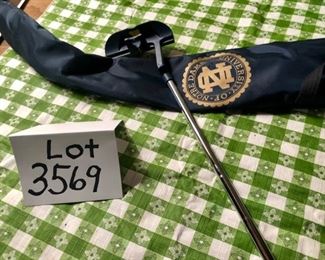 Lot 3569. $30.00. The putter is not branded Notre Dame but has some interesting marks to assist with Putting Angle and Position.  The sheath is blue nylon with the Notre Dame Logo in Gold. Gift Idea?