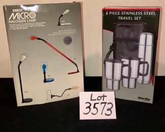 Lot 3573.  $44.00. Zelco Micro Halogen Lamp, plus 4 pc stainless steel travel set by Worthy.  Only one lamp but one box is an outer box for the lamp, which is black.  