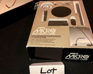 Lot 3573.  $44.00. Zelco Micro Halogen Lamp, plus 4 pc stainless steel travel set by Worthy.  Only one lamp but one box is an outer box for the lamp, which is black.  