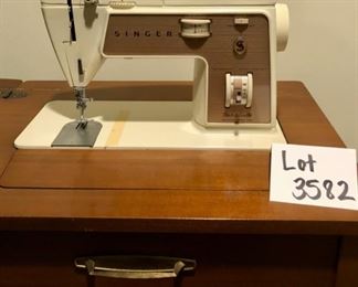 Lot 3582. Asking $140.00 Singer Sewing Machine Table. Singer Touch & Sew Zig-Zag Model 758. Beautiful cabinet and very easy Singer machine to operate