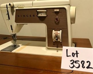 Lot 3582. Asking $140.00  Singer Sewing Machine Table. Singer Touch & Sew Zig-Zag Model 758. Beautiful cabinet and very easy Singer machine to operate