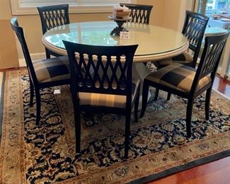 Lot 4001. Asking $1200.00 (Firm) Remi Lugano Limestone table from Italy, with beveled glass top and 6 Emerson et cie Chairs (Paid $3000 for table alone, the beveled glass was another $1000.00 and the chairs were 700.00 Ea.   The Table Top and Base weigh easily 600 lbs.  One of a kind piece that we have never seen in over 20 years of conducting estate sales,  Current location is in Naperville. The rug is from India 8' x 8' and we are including with the table as a bonus.  Note:  We sold this to a customer at our last sale; movers tried to deliver it, but it would not clear the stairs going to her basement.  The movers had to bring it to our garage.  One seat cushion fabric needs to be cleaned, otherwise it shows beautifully. - Top cleans with Windex!