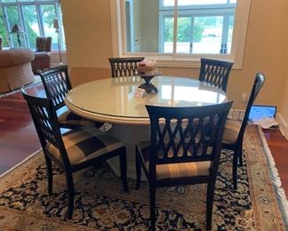 Lot 4001. Asking $1200.00 (Firm) Remi Lugano Limestone table from Italy, with beveled glass top and 6 Emerson et cie Chairs (Paid $3000 for table alone, the beveled glass was another $1000.00 and the chairs were 700.00 Ea.   The Table Top and Base weigh easily 600 lbs.  One of a kind piece that we have never seen in over 20 years of conducting estate sales,  Current location is in Naperville. The rug is from India 8' x 8' and we are including with the table as a bonus.  Note:  We sold this to a customer at our last sale; movers tried to deliver it, but it would not clear the stairs going to her basement.  The movers had to bring it to our garage.  One seat cushion fabric needs to be cleaned, otherwise it shows beautifully. - Top cleans with Windex!