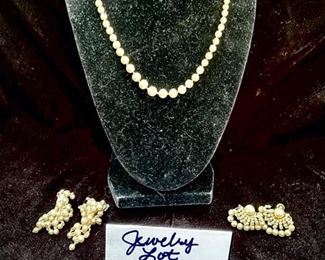 Jewelry Lot 4000-P.  $32.00. One 17" pearl necklace, with graduated size pearls, each tied, and two pairs of pearl cluster earrings, one clip-ons, and one screw-ons.  The necklace pearls feel gritty to the tooth, the earrings do not. but this is a lovely set and perfect as a gift for the pearl lover.  All are vintage.  Earrings are clip-on and 1-3/4" drop, and the screw-ons are just over an inch wide.  